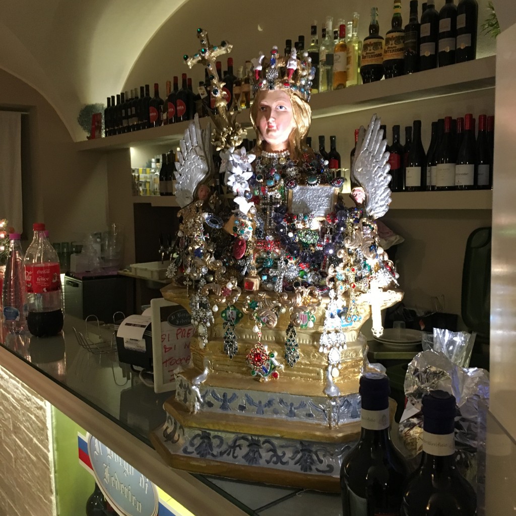 Santa Agata Statue on the counter of a local restaurant 